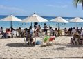 vacacionistas en playas